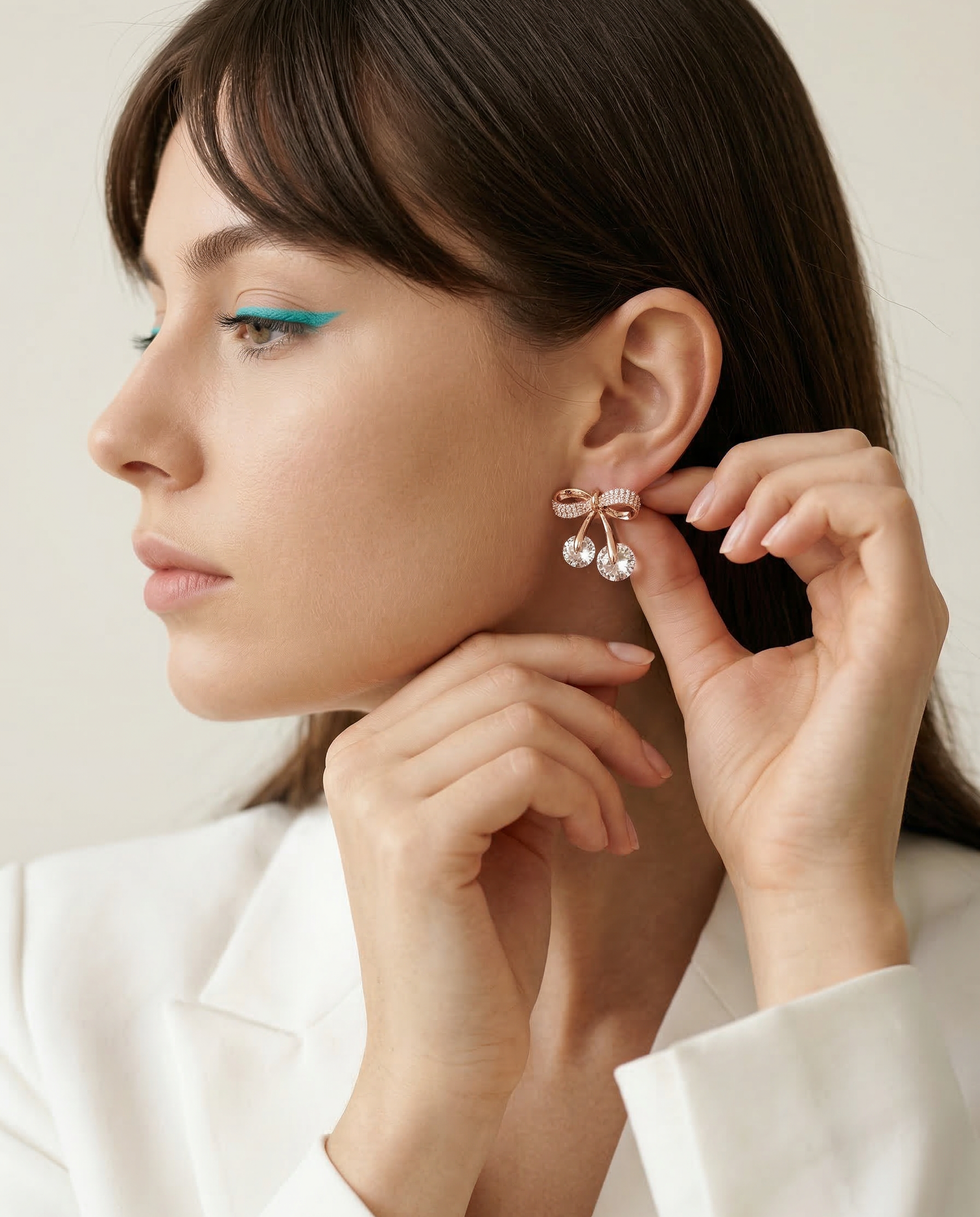 Crystal Bow Stud Earrings with Twin Drop Accents